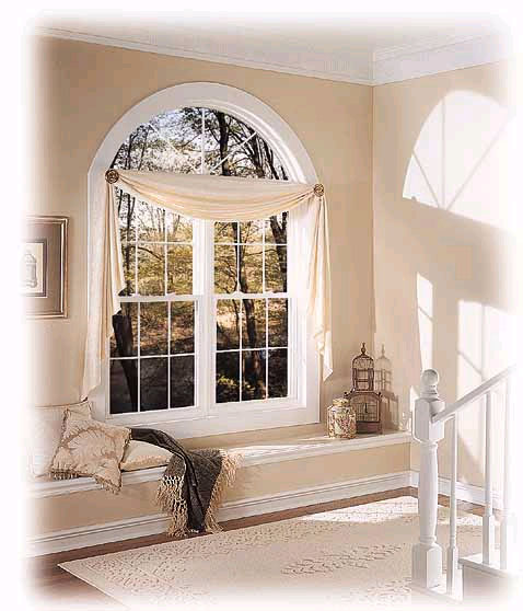 Vinyl replacement window with an arched transom and window seat